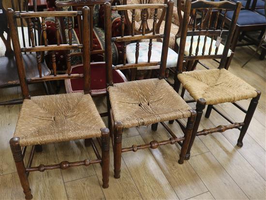 Three early 19th century two-tier spindle back chairs with rush seats